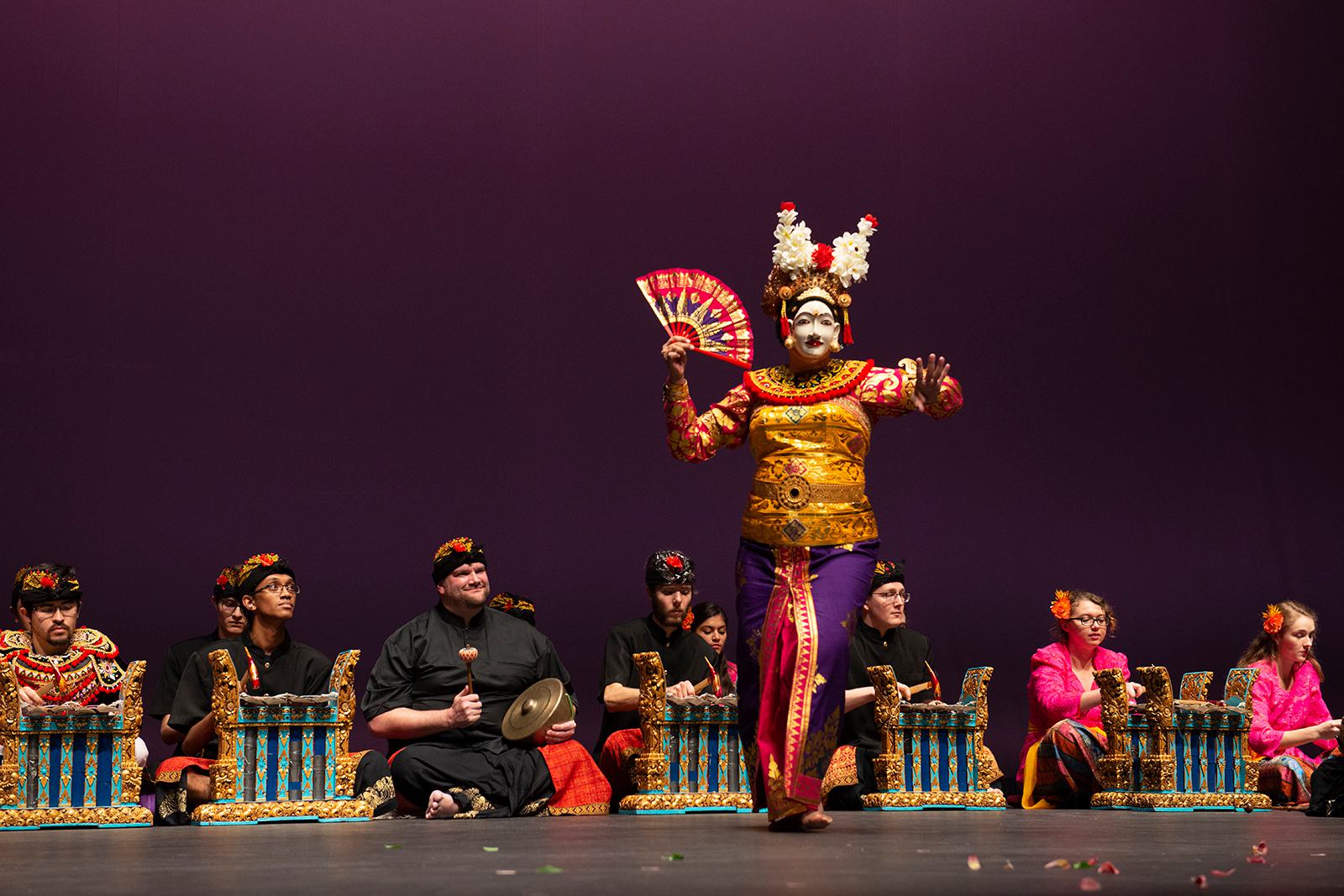 Member of the UMD Balinese Gamelan Saraswati Ensemble perform on stage.