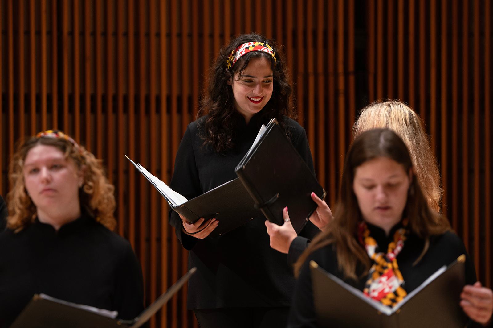 Choral students sing during a performance.
