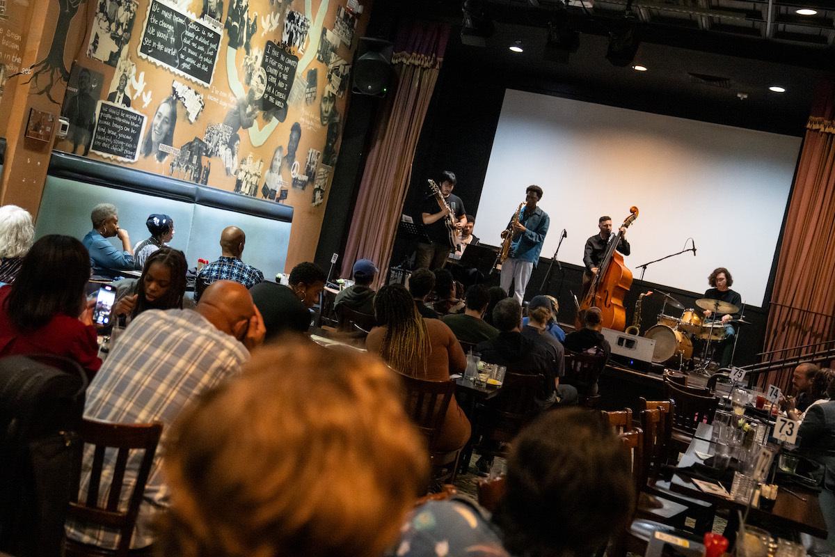 Jazz band plays on stage at Busboys and Poets.