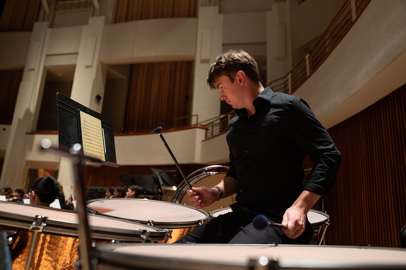 Student plays the timpani during a performance.