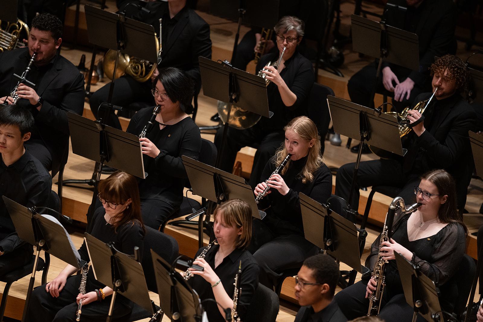 The UMD Wind Orchestra performs on stage.