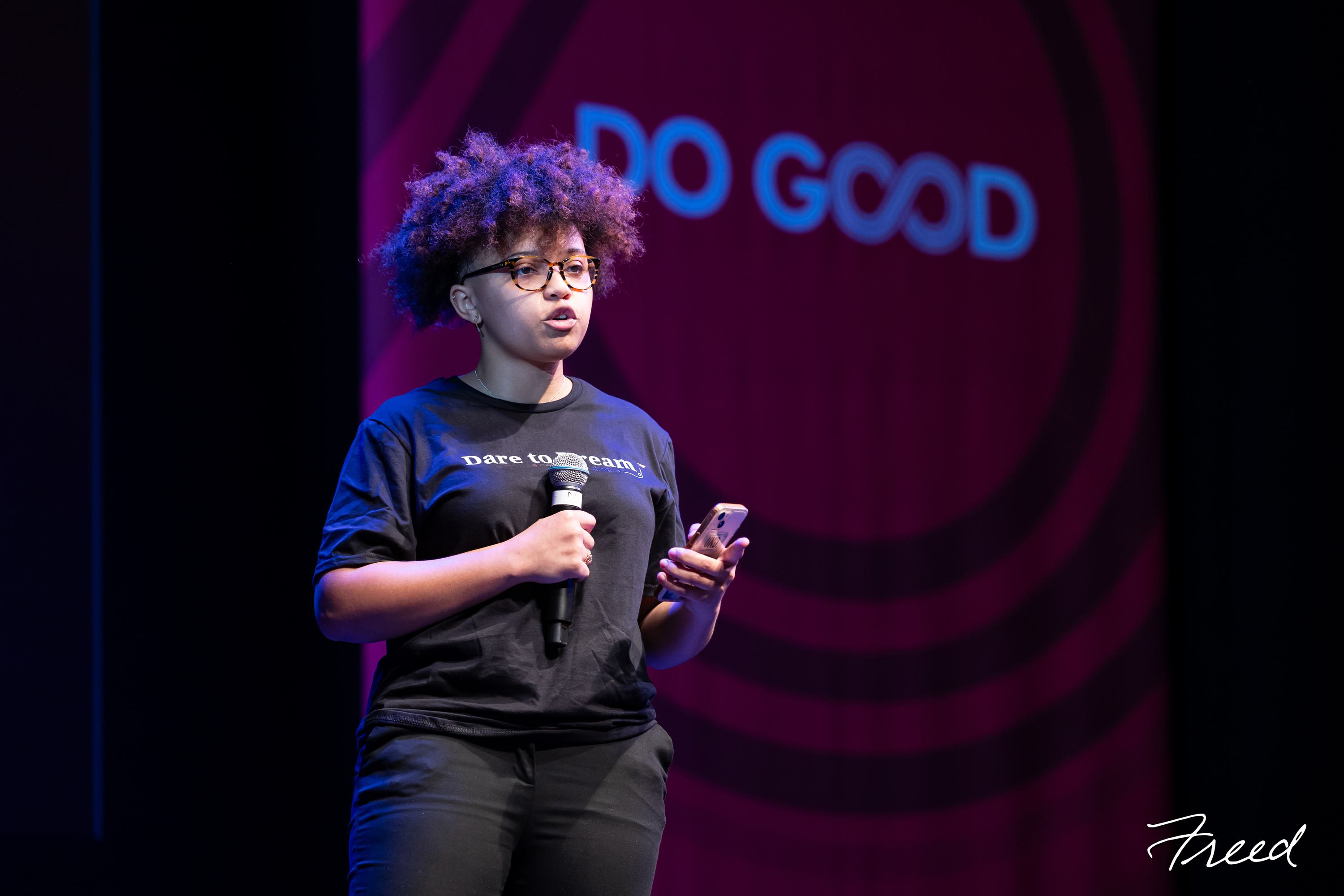 Student speaking into a mic