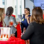 Alumni talking at an event