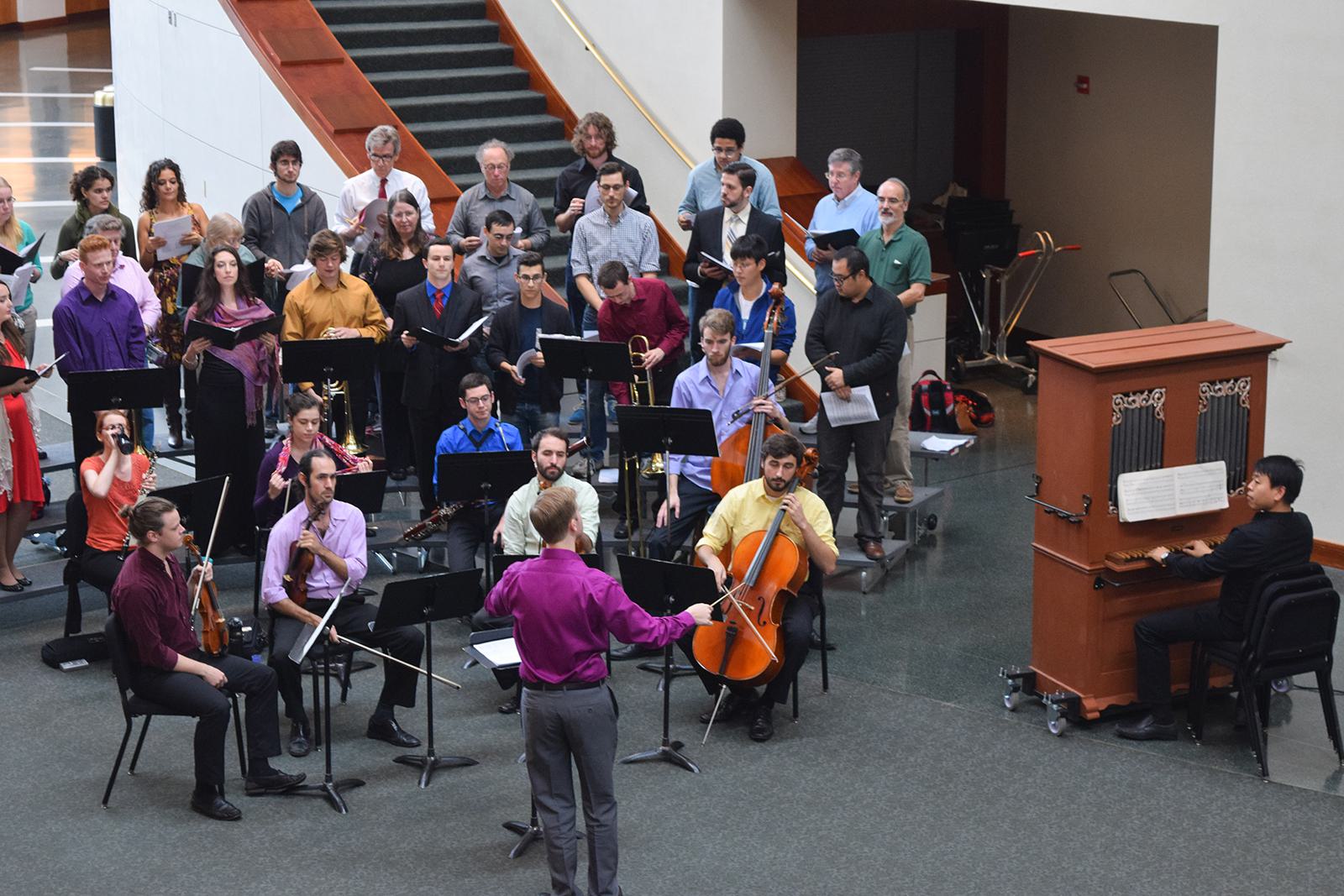 A director conducts an ensemble in The Clarice' Grand Pavilion.