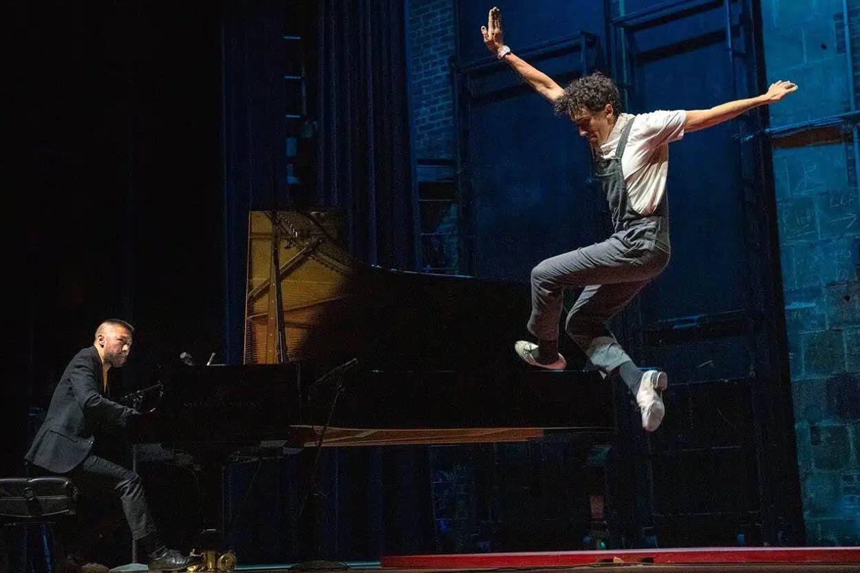 Conrad Tao plays piano and Caleb Teicher tap dances during a performance.