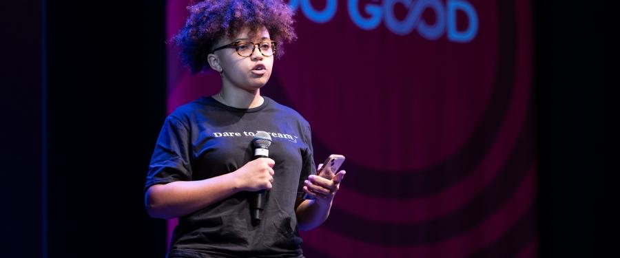 Student speaking into microphone