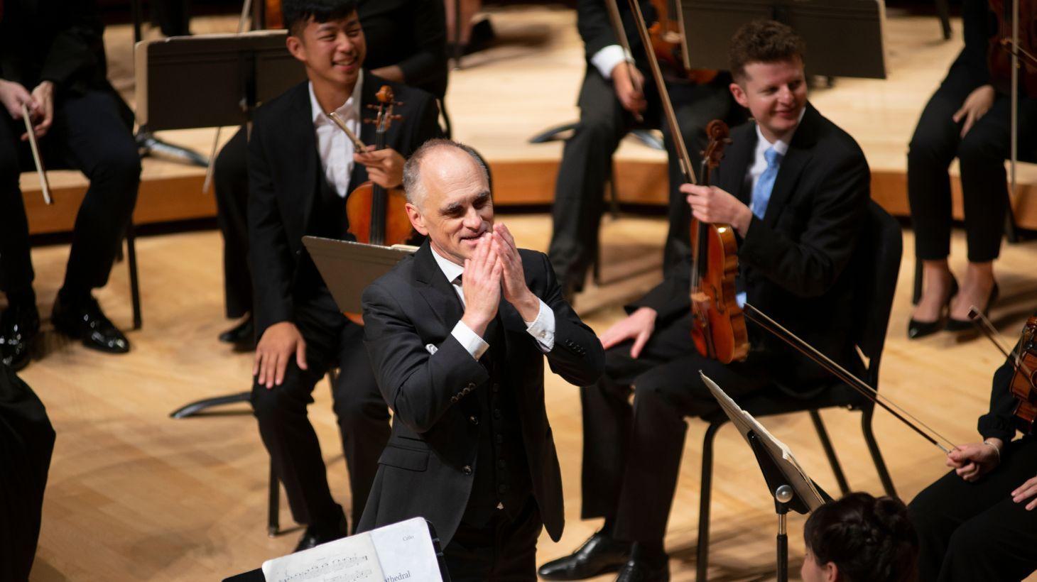 David Neely conducts orchestra.