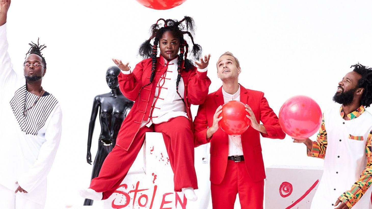 Band members from Tank and The Bangas pose with red balls.