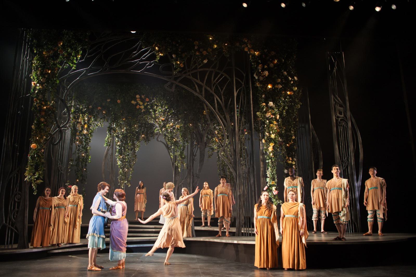 Opera singers perform on stage.