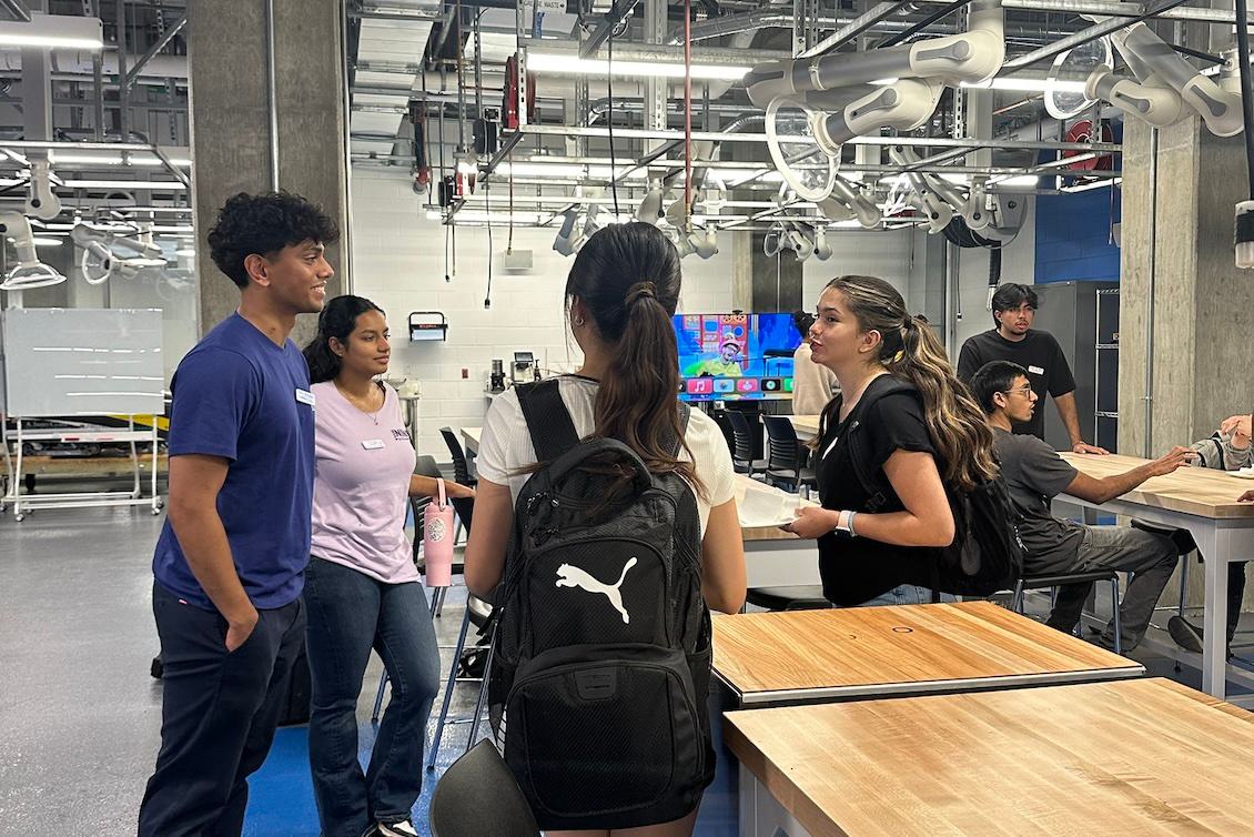 Students conversing at a MiXer event