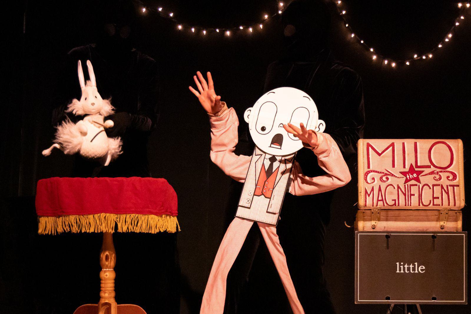 A cartoon-looking puppet surprised by a white rabbit.