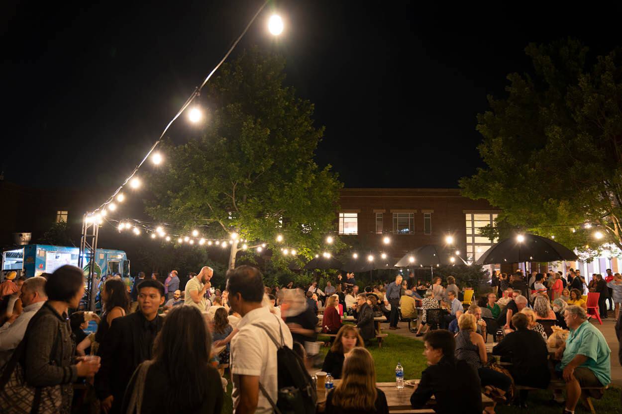 People gather for the evening in The Clarice's courtyard for food and drink.