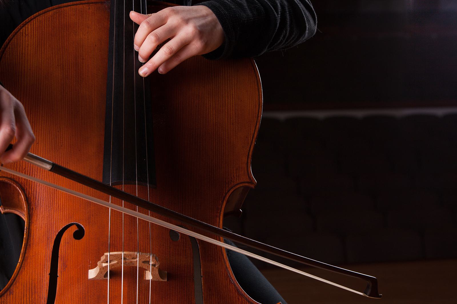 A person plays a cello.