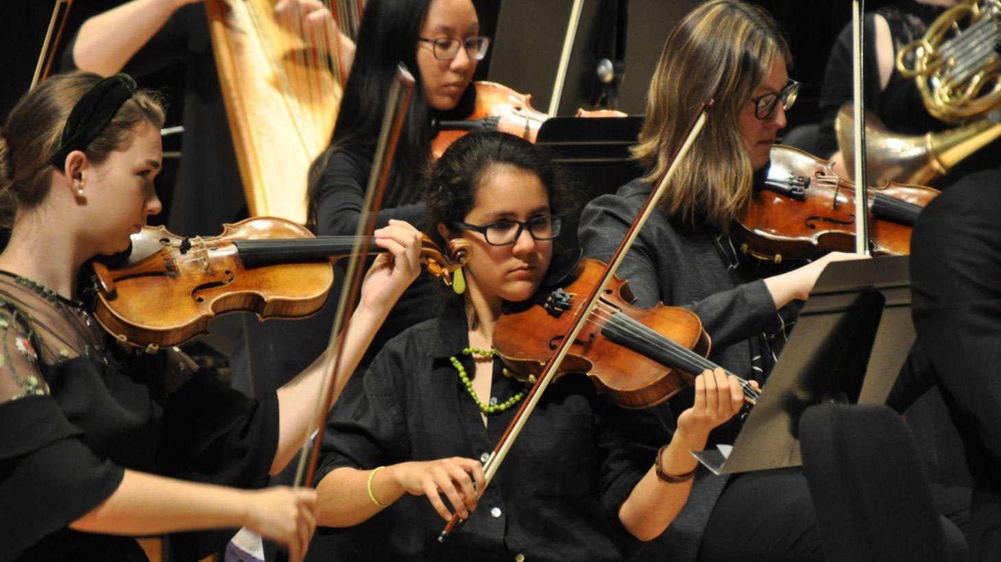 University Orchestra performs on stage.