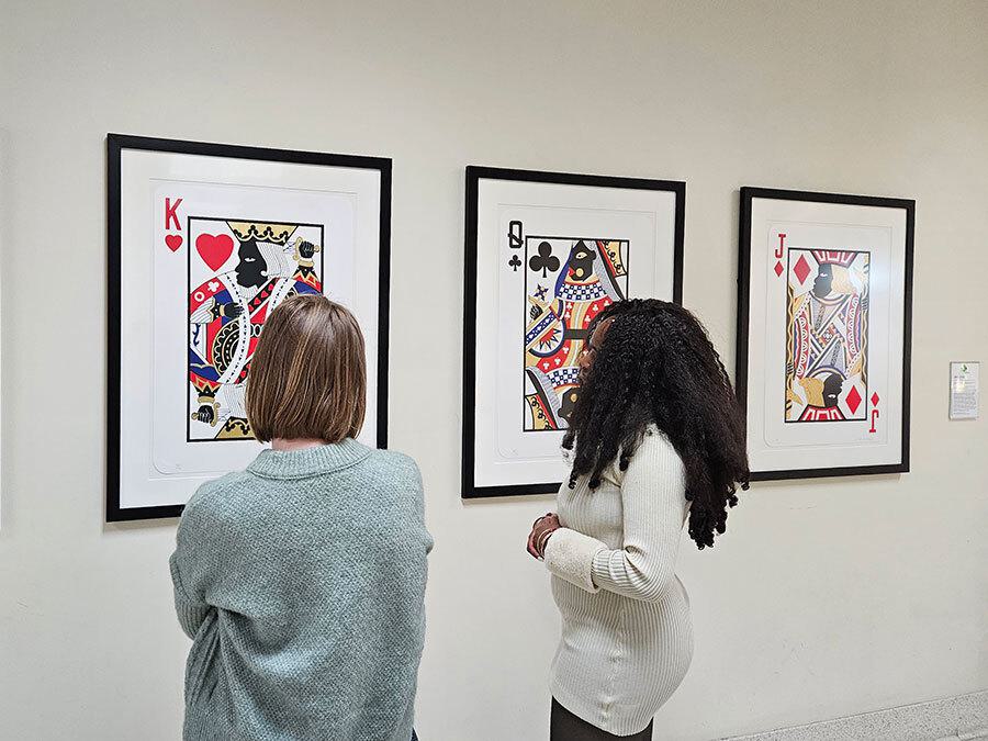 Two students looking at art