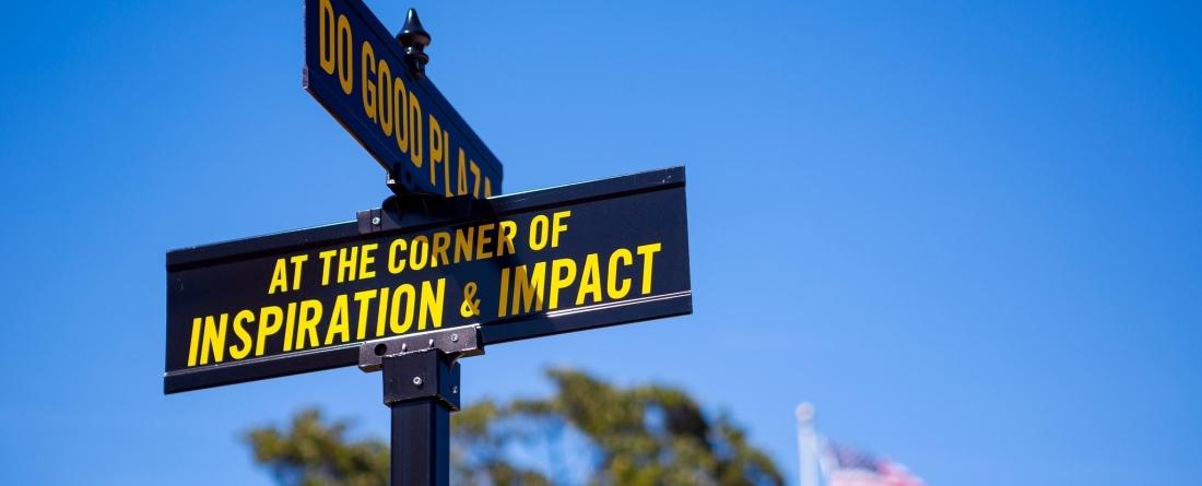 Photo of street signs outside of the Do Good Plaza